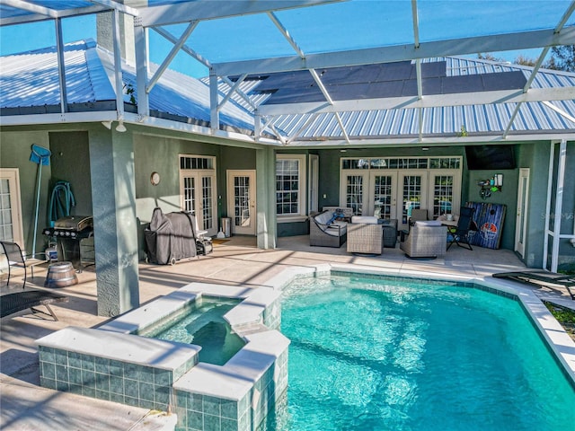 view of pool featuring a patio area, an in ground hot tub, french doors, and grilling area