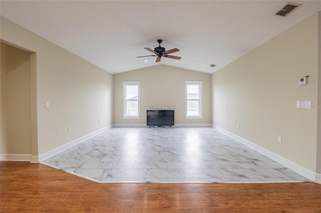 unfurnished living room featuring ceiling fan, light hardwood / wood-style flooring, and vaulted ceiling