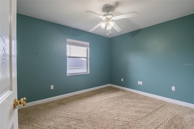 unfurnished room featuring carpet and ceiling fan