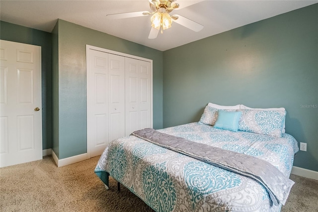 bedroom featuring ceiling fan, a closet, and carpet floors