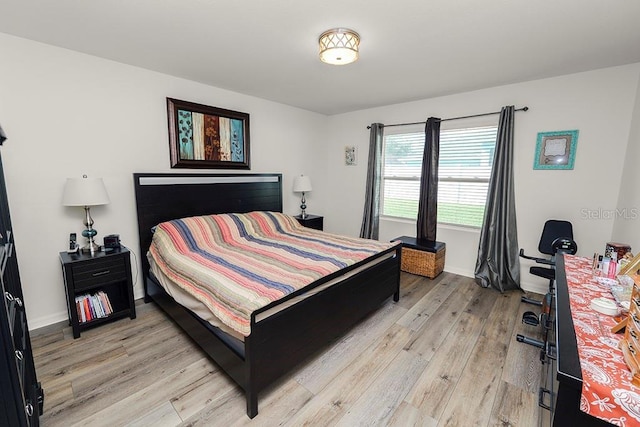 bedroom with light hardwood / wood-style flooring