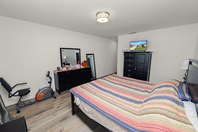 bedroom with light hardwood / wood-style flooring