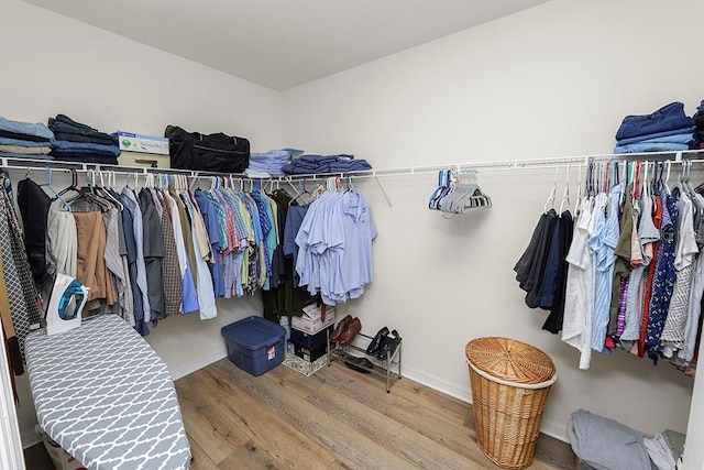 spacious closet featuring hardwood / wood-style floors