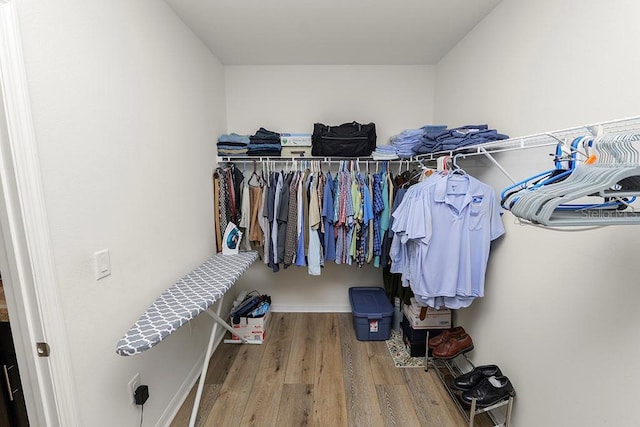 spacious closet featuring hardwood / wood-style flooring