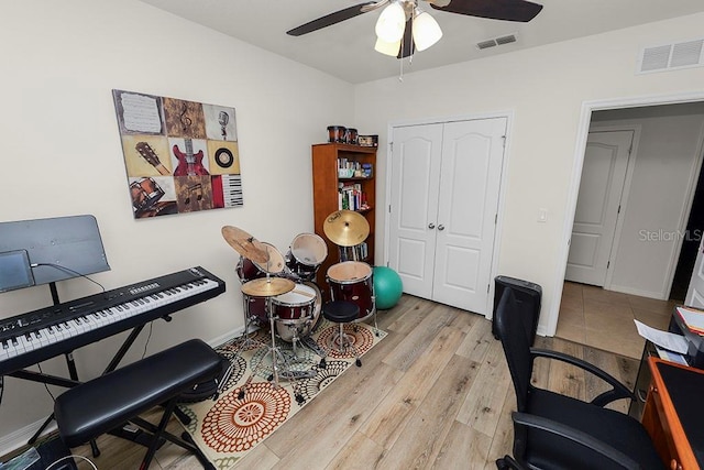 office space featuring ceiling fan and light hardwood / wood-style floors