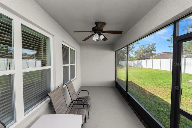 sunroom / solarium with ceiling fan