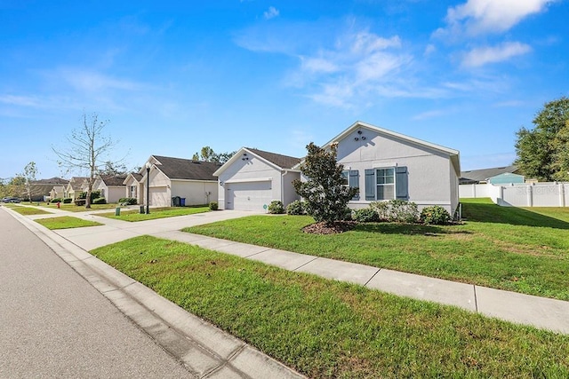 ranch-style home featuring driveway, a residential view, and a garage