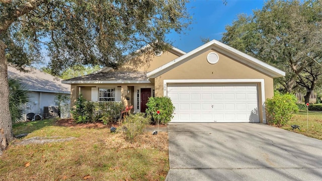 ranch-style home featuring central AC unit, a front yard, and a garage