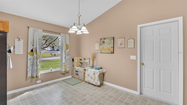 foyer entrance with a notable chandelier and lofted ceiling