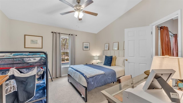 bedroom featuring ceiling fan, lofted ceiling, and light carpet