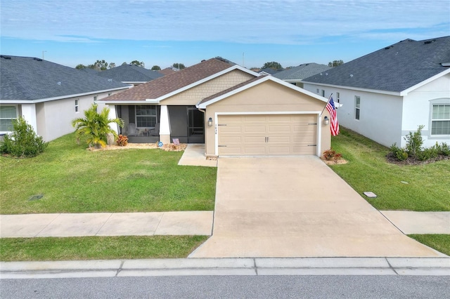 ranch-style house featuring a garage and a front lawn