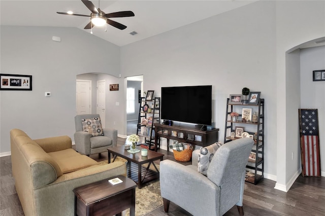 living room featuring ceiling fan, dark hardwood / wood-style flooring, and vaulted ceiling