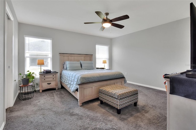 bedroom featuring ceiling fan and dark carpet