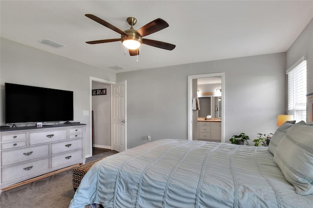 bedroom featuring carpet flooring, ceiling fan, and ensuite bathroom