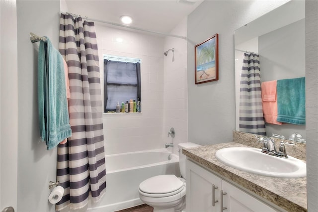 full bathroom featuring vanity, toilet, and shower / tub combo with curtain