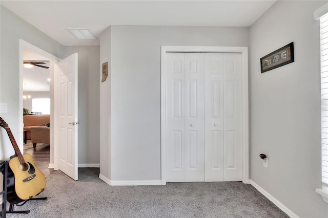 unfurnished bedroom featuring carpet floors and a closet