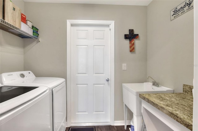 washroom with washer and dryer and dark hardwood / wood-style flooring