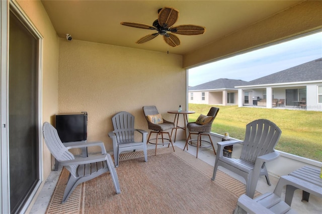 view of patio / terrace featuring ceiling fan