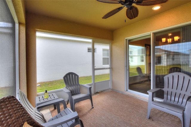 sunroom / solarium with ceiling fan