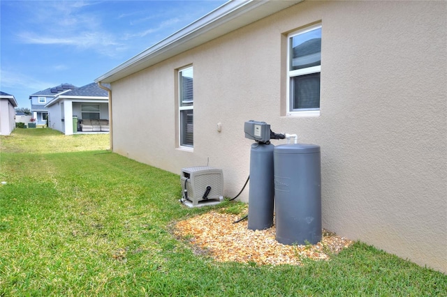 view of property exterior with a lawn