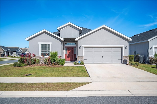 view of front of home featuring a front yard and a garage