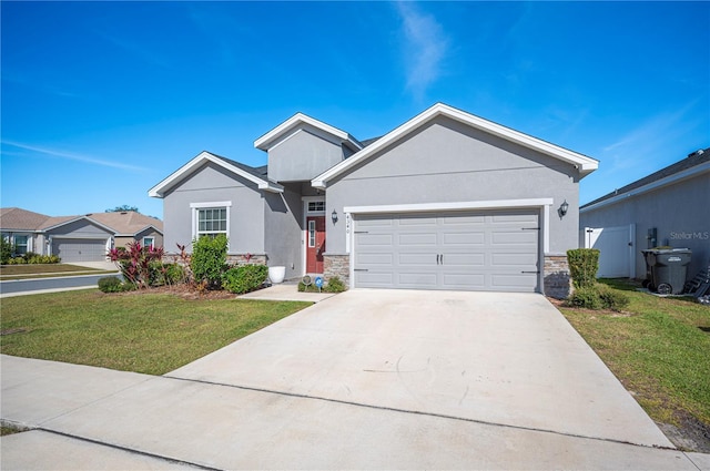 view of front of house featuring a garage and a front yard