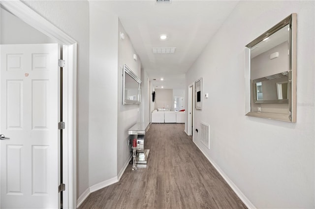 hallway featuring hardwood / wood-style flooring