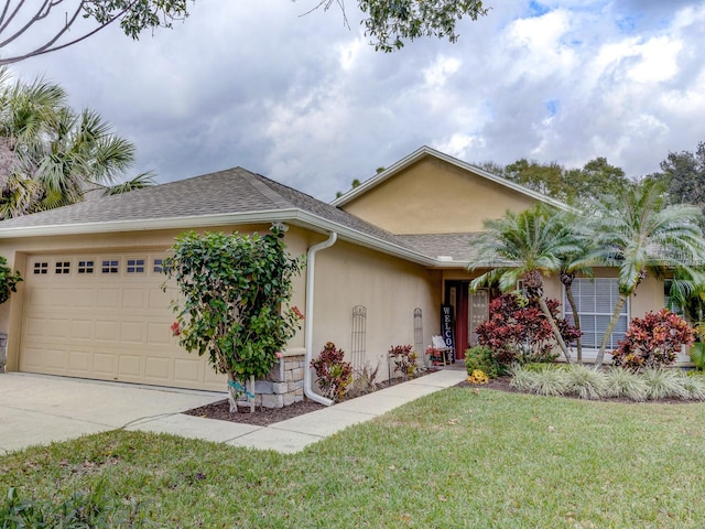 single story home with a garage and a front yard