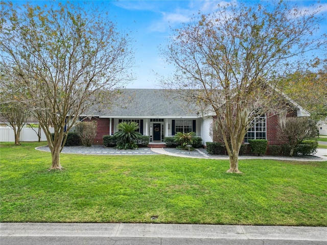 single story home featuring a front lawn