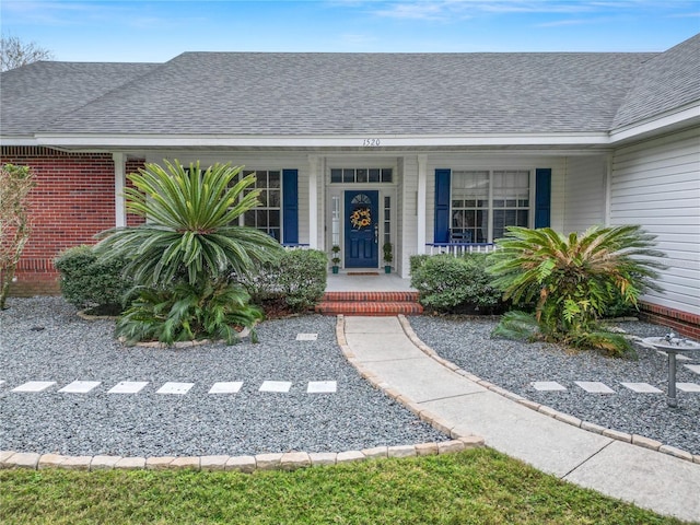 doorway to property featuring a porch