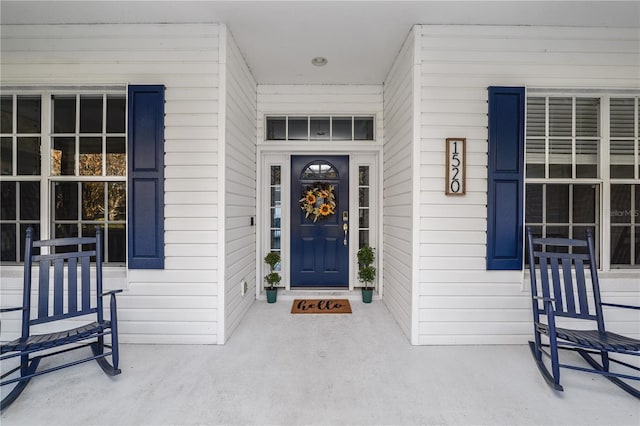 doorway to property featuring covered porch