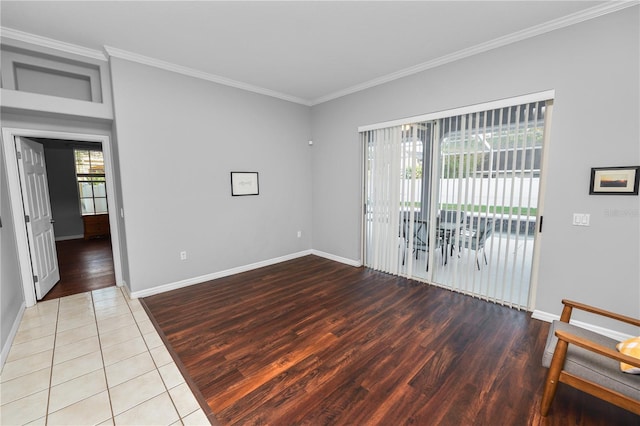 tiled spare room with plenty of natural light and ornamental molding