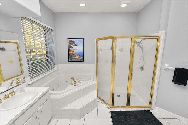 bathroom featuring tile patterned flooring, vanity, and independent shower and bath