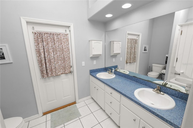 full bathroom with tile patterned floors, vanity, and toilet