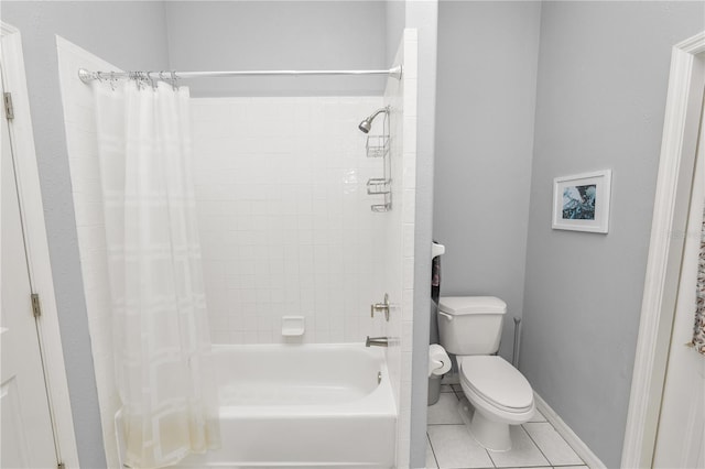 bathroom with toilet, shower / tub combo, and tile patterned floors