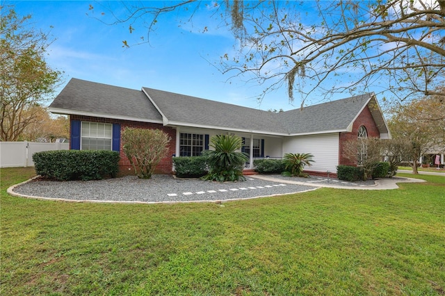 single story home with a front yard