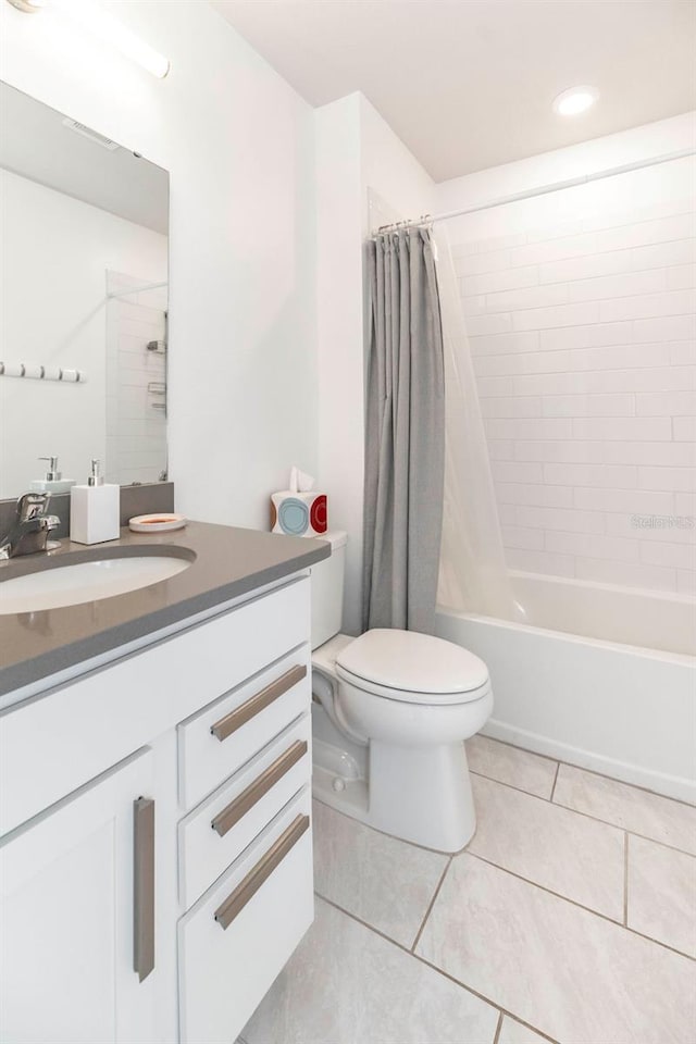 full bath with toilet, shower / bathtub combination with curtain, vanity, and tile patterned floors