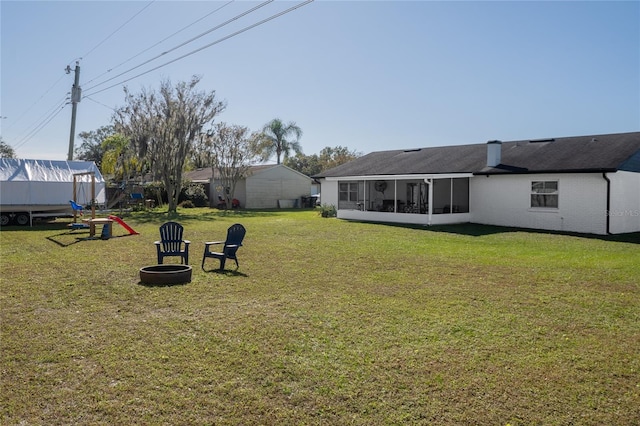 view of yard with a sunroom