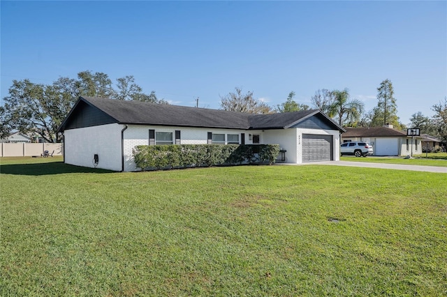 ranch-style home with a front yard and a garage