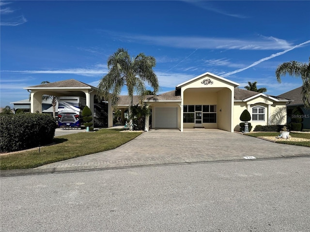 single story home with a front lawn and a garage