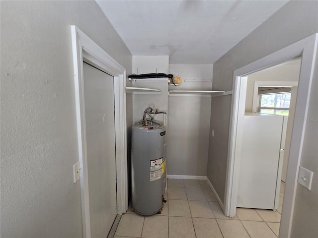 utility room featuring water heater