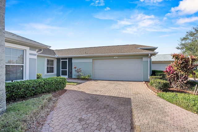 ranch-style home with a garage