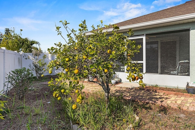 view of yard with a sunroom