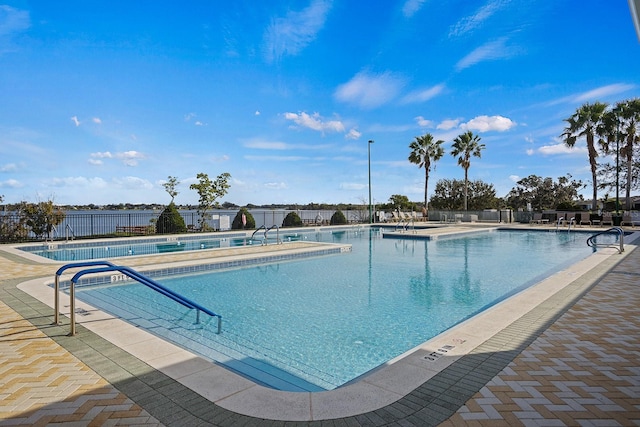 view of swimming pool with a patio area