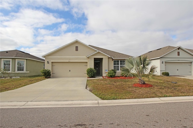 ranch-style house with a garage and a front lawn