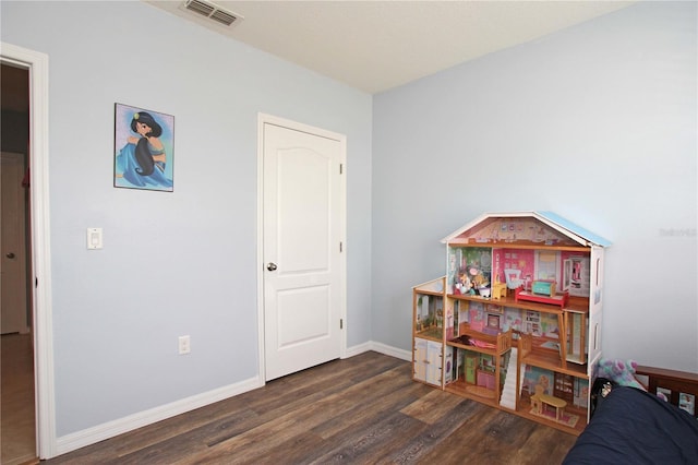 game room with dark hardwood / wood-style floors