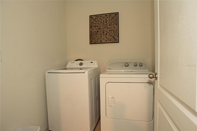 clothes washing area with washing machine and clothes dryer