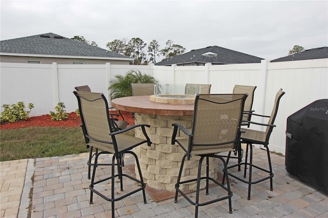 view of patio / terrace featuring a bar and grilling area