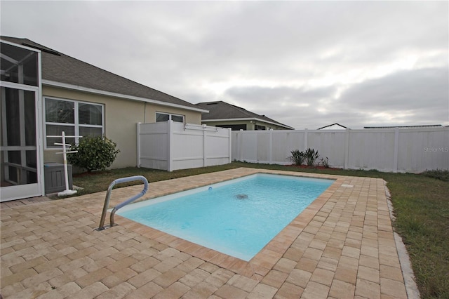 view of pool featuring a patio