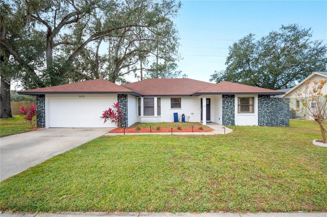 ranch-style house with a garage and a front lawn